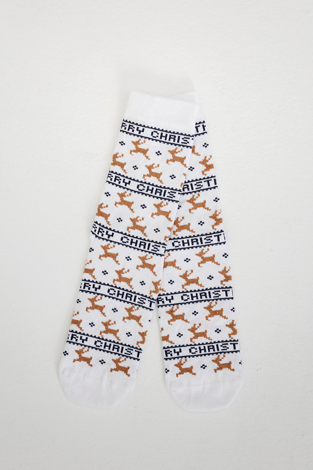 Hvite julesokker med reinsdyr på.